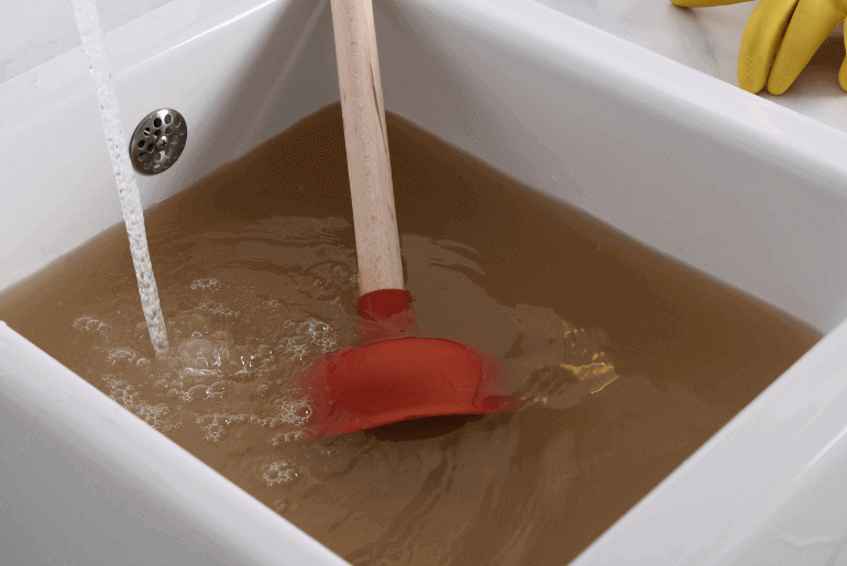 unclog a garbage disposal with a plunger
